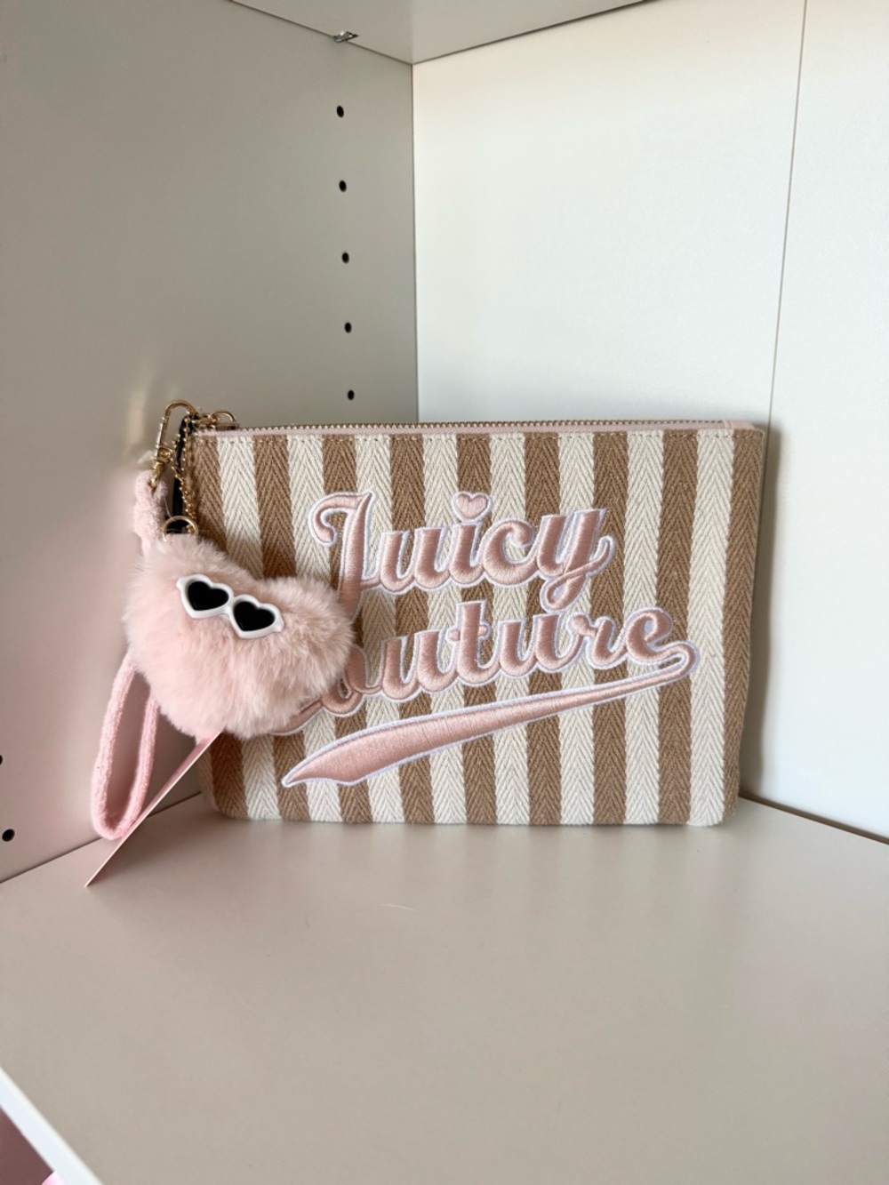Juicy Couture “Free To Be Juicy” Striped Wristlet with Heart Pom Charm